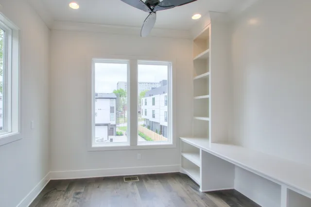 a view of room with window and hardwood floor