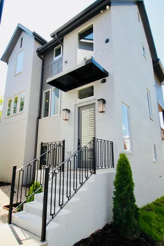 a view of a house with wooden fence