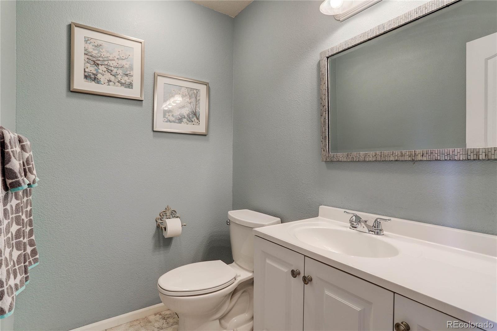 10922 Conifer Mountain Road Conifer, CO 80433 - Photo 16 of 37 a bathroom with a sink and a toilet