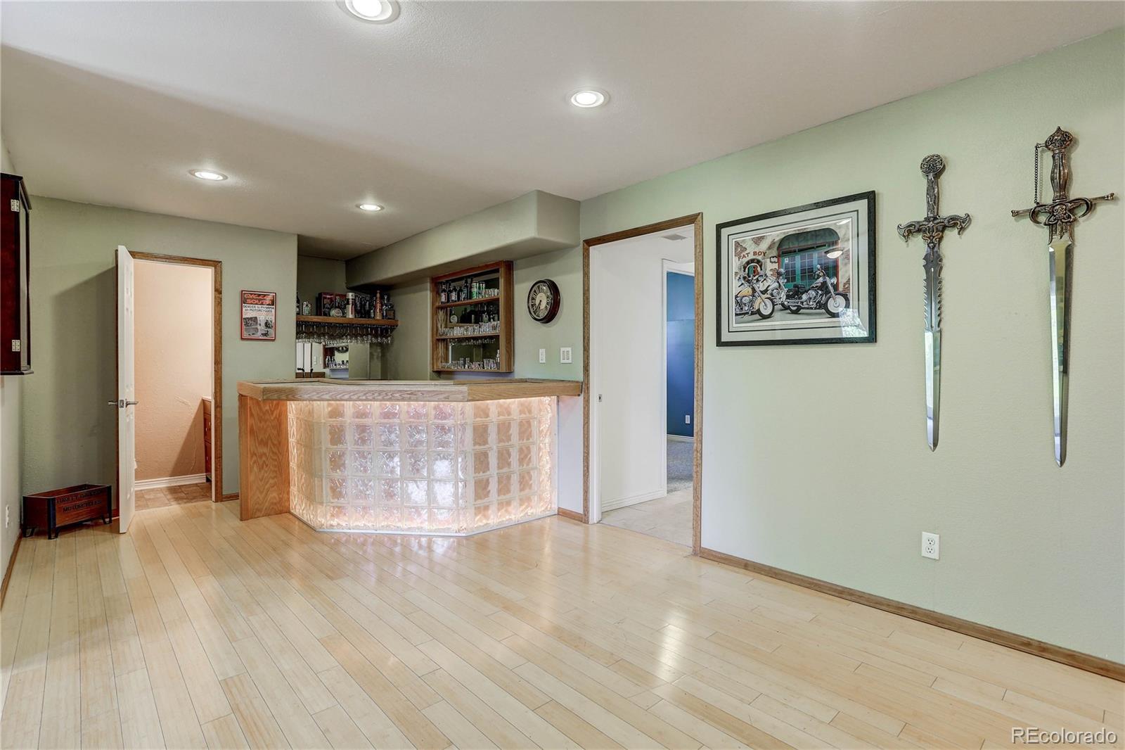 10922 Conifer Mountain Road Conifer, CO 80433 - Photo 28 of 37 a view of a refrigerator in kitchen and wooden floor