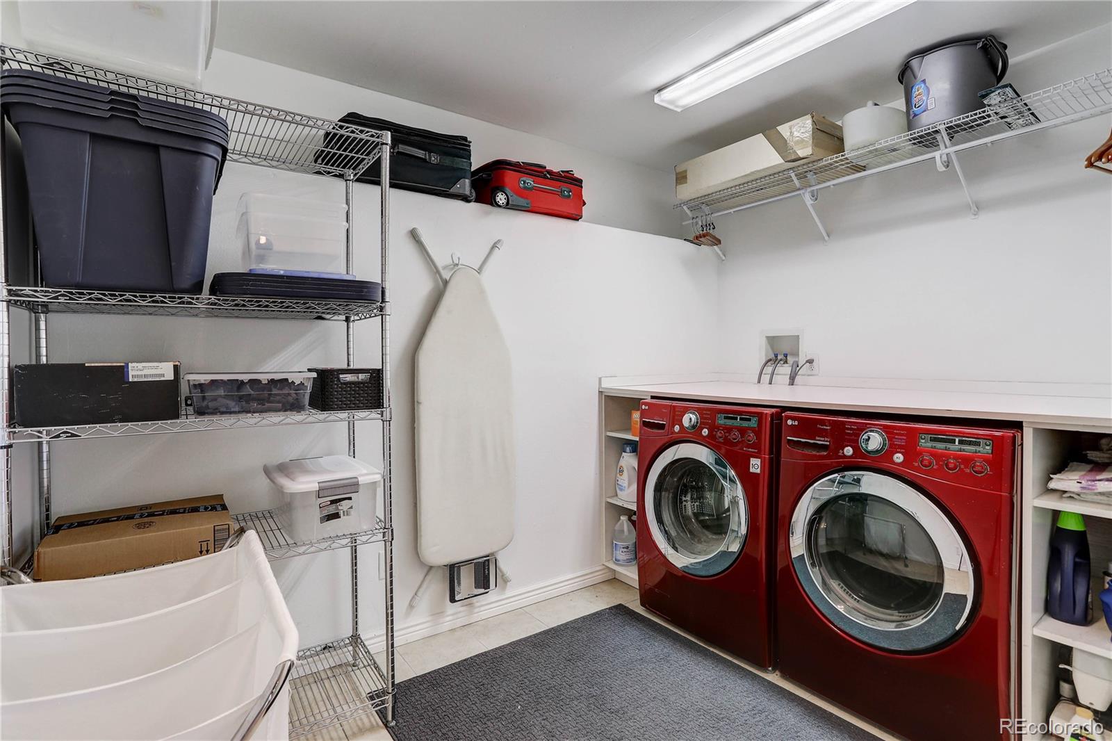 10922 Conifer Mountain Road Conifer, CO 80433 - Photo 32 of 37 a utility room with dryer and washer