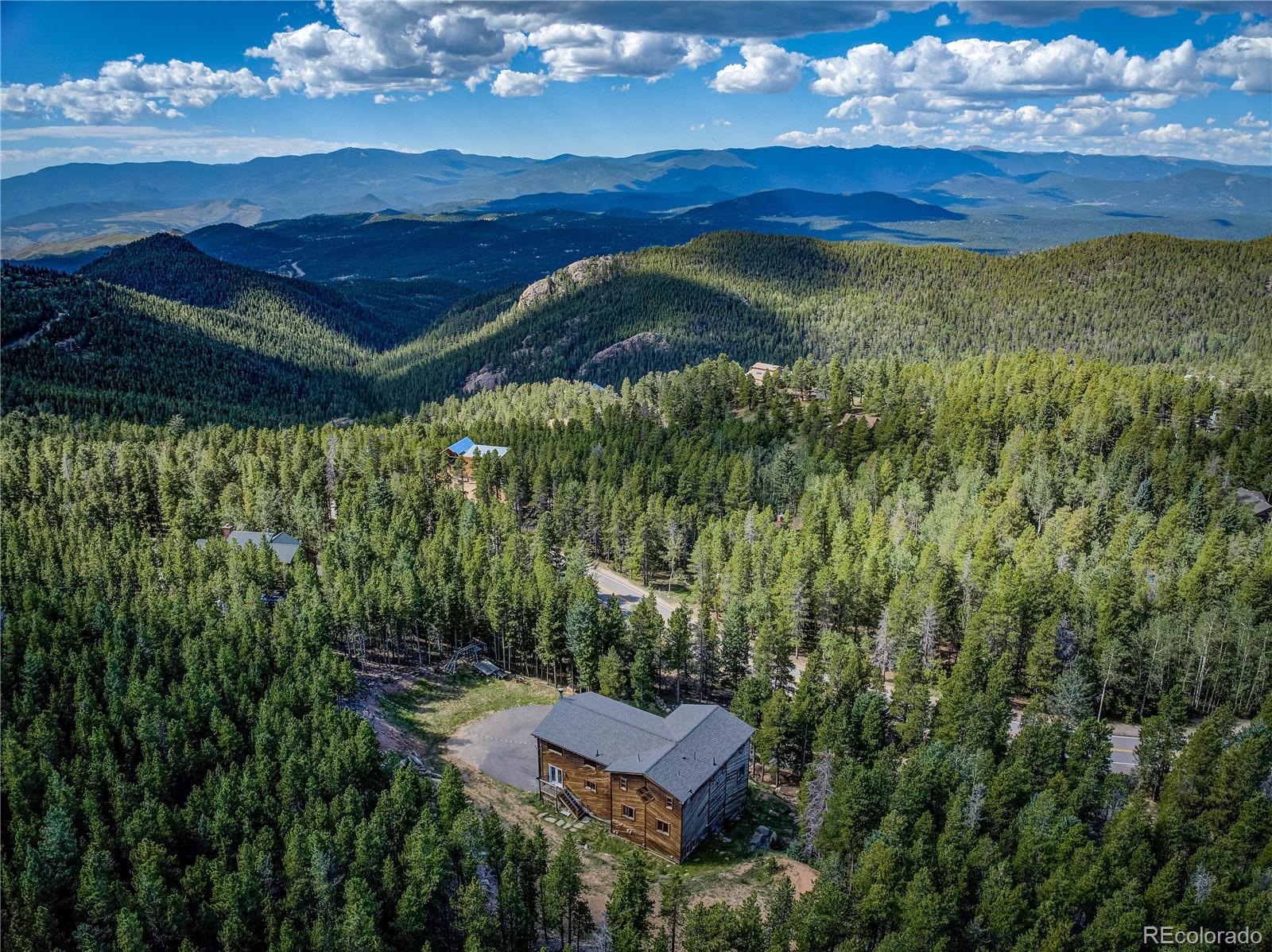 10922 Conifer Mountain Road Conifer, CO 80433 - Photo 34 of 37 a view of an outdoor space and a yard