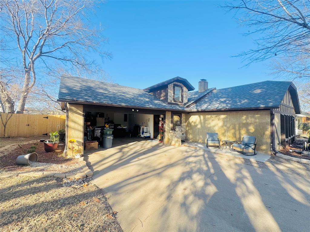 1109 Simpson Terrace Bedford, TX 76021 - Photo 16 of 39 a view of a chairs and table in the patio