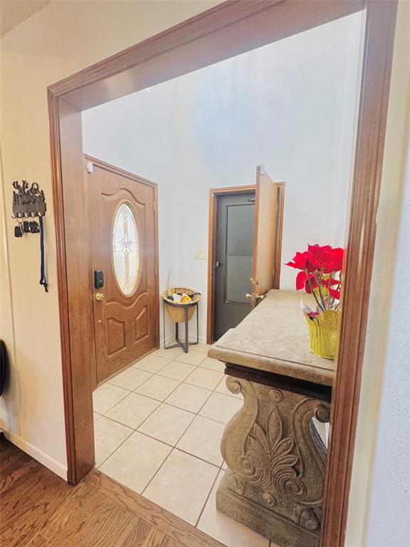 1109 Simpson Terrace Bedford, TX 76021 - Photo 17 of 39 a view of a bedroom with furniture and wooden floor
