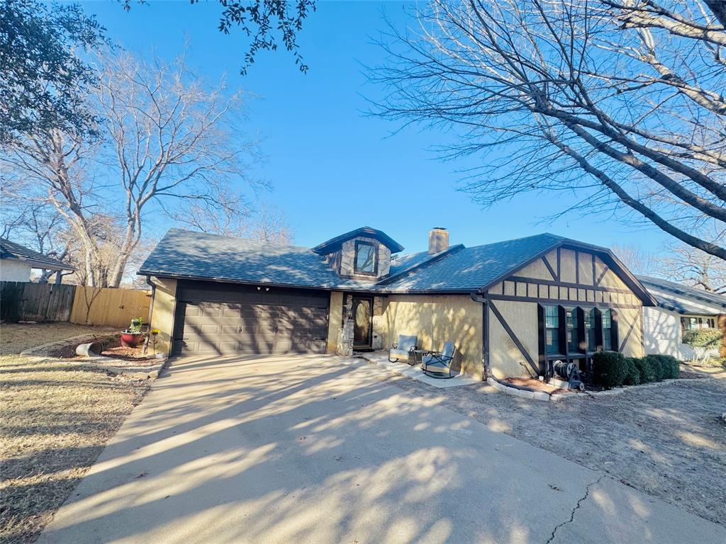 1109 Simpson Terrace Bedford, TX 76021 - Photo 20 of 39 a view of a building with a street