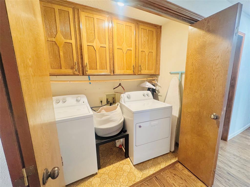 1109 Simpson Terrace Bedford, TX 76021 - Photo 25 of 39 a utility room with a sink a washer and dryer