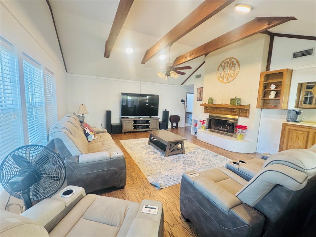 1109 Simpson Terrace Bedford, TX 76021 - Photo 27 of 39 a living room with furniture and a flat screen tv