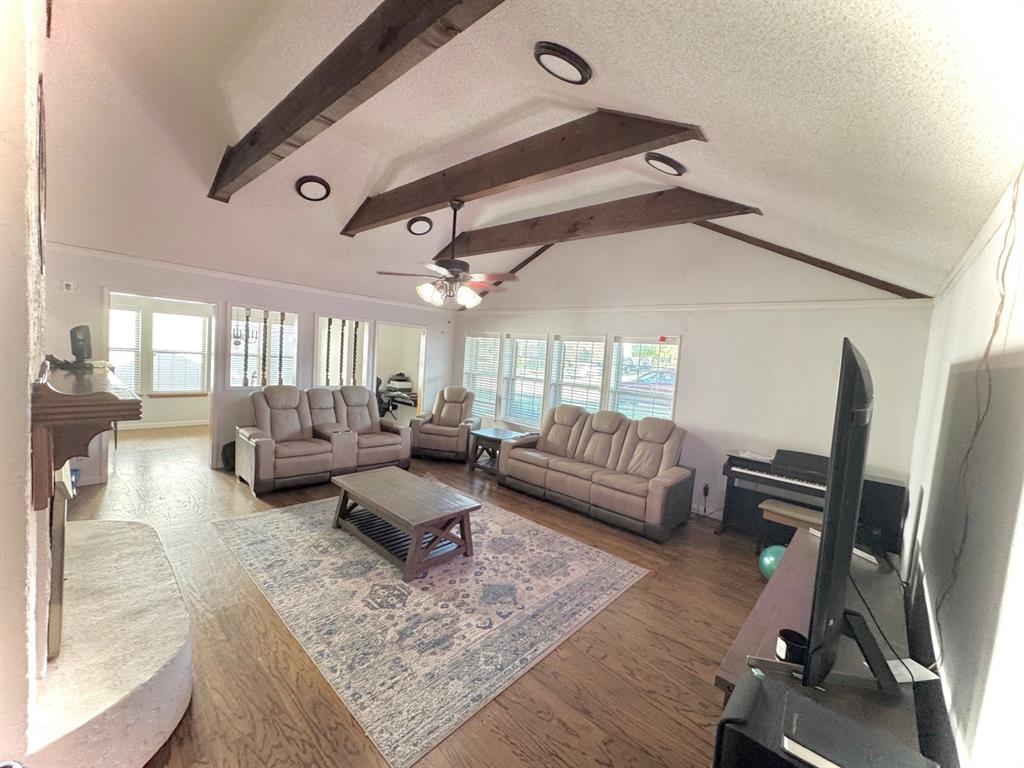 1109 Simpson Terrace Bedford, TX 76021 - Photo 3 of 39 a living room with furniture and a flat screen tv