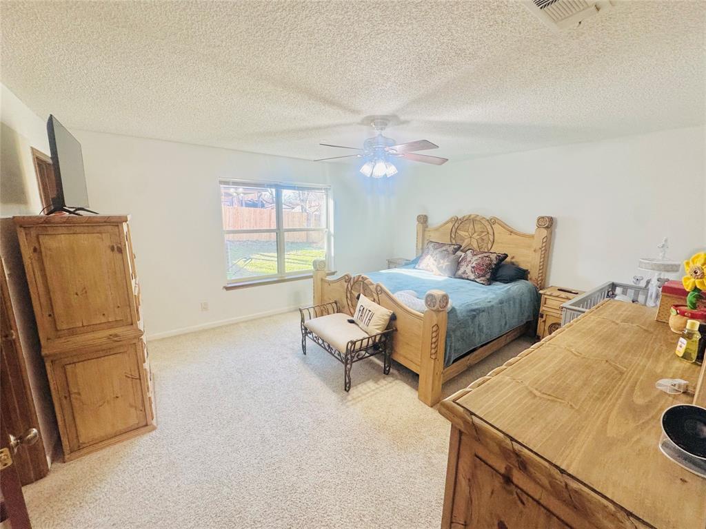 1109 Simpson Terrace Bedford, TX 76021 - Photo 31 of 39 a living room with furniture and a flat screen tv