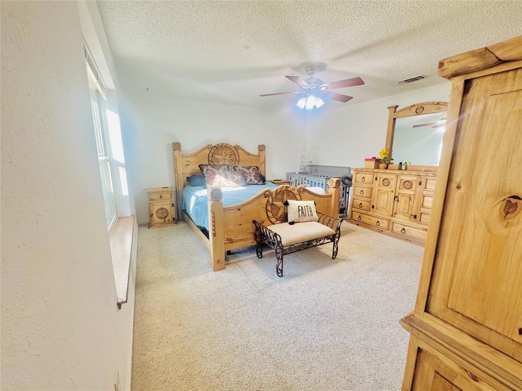 1109 Simpson Terrace Bedford, TX 76021 - Photo 32 of 39 a living room with furniture and a flat screen tv