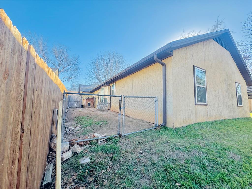 1109 Simpson Terrace Bedford, TX 76021 - Photo 36 of 39 a view of backyard with plants and wooden fence