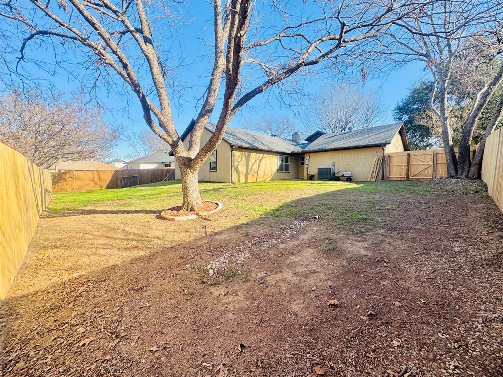 1109 Simpson Terrace Bedford, TX 76021 - Photo 10 of 39 a view of an house with backyard and trees