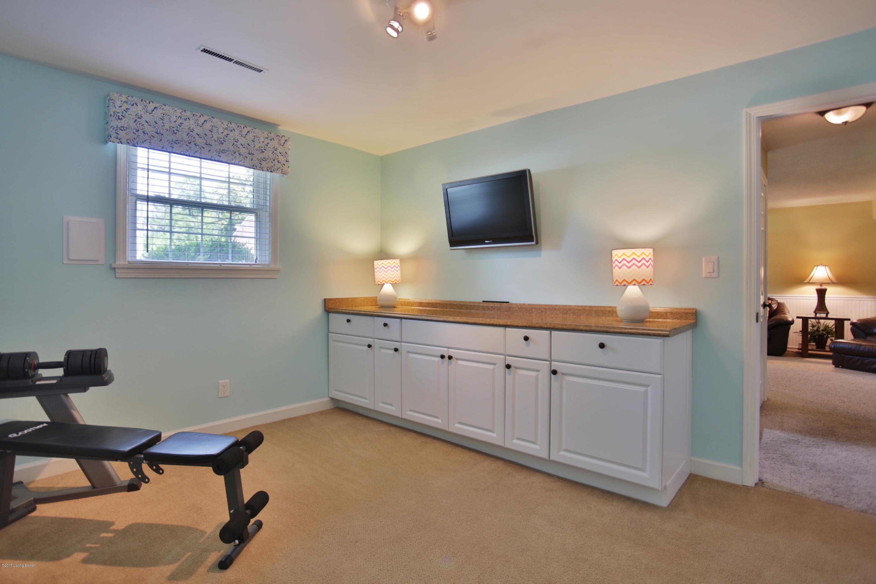 12210 Hardwick Road Louisville, KY 40243 - Photo 25 of 44 Bedroom 4/office/playroom in lower level with egress, closet and cabinetry