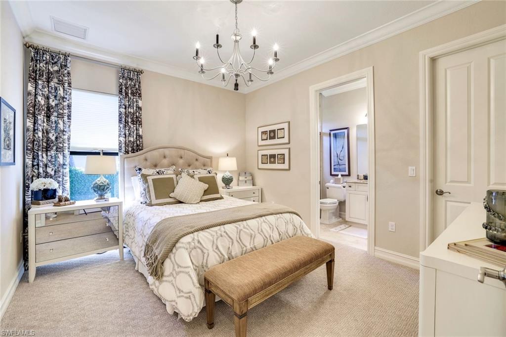 7304 Hagen Way Naples, FL 34113 - Photo 17 of 37 Bedroom with an inviting chandelier, light carpet, ornamental molding, and visible vents