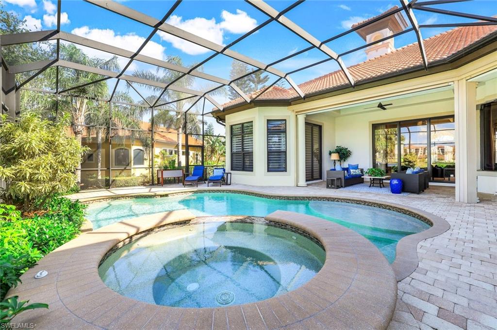 7304 Hagen Way Naples, FL 34113 - Photo 26 of 37 View of pool featuring an outdoor hangout area, a pool with connected hot tub, a patio, glass enclosure, and a ceiling fan