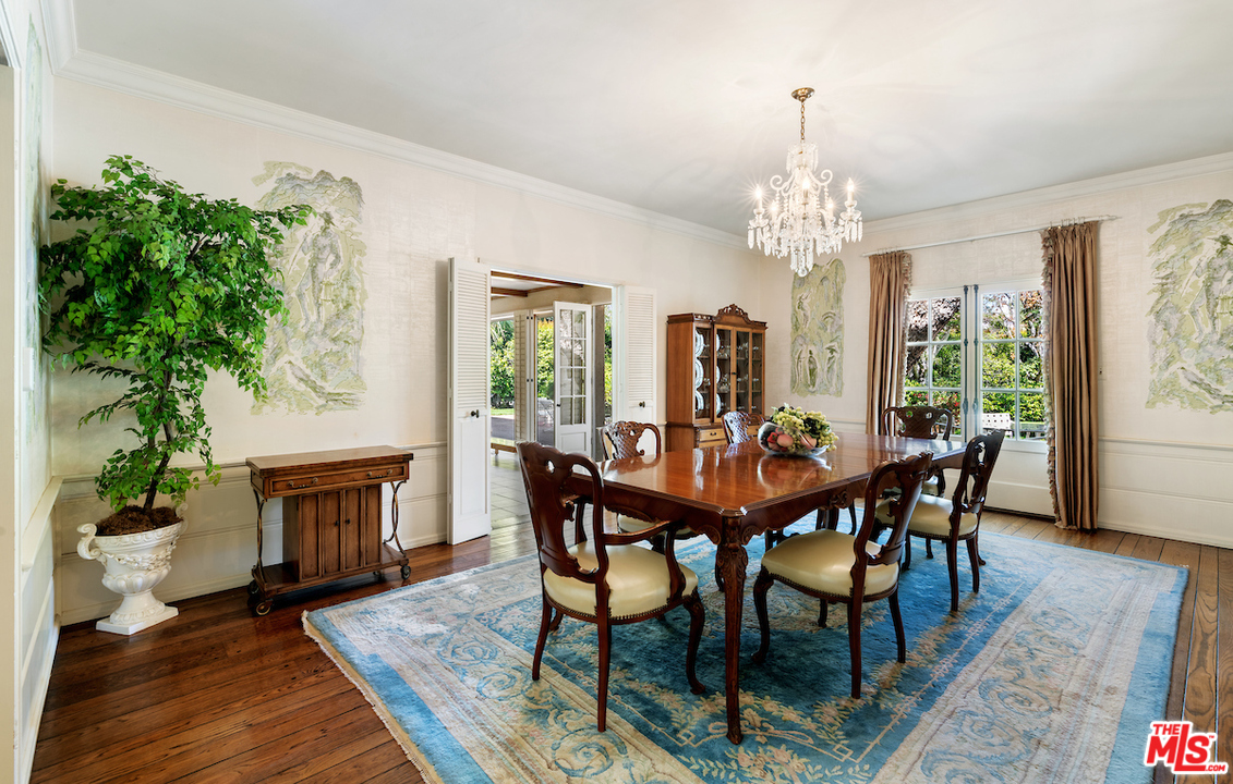 300 South Rockingham Avenue Los Angeles, CA 90049 - Photo 18 of 49 a view of a dining room with furniture window and wooden floor