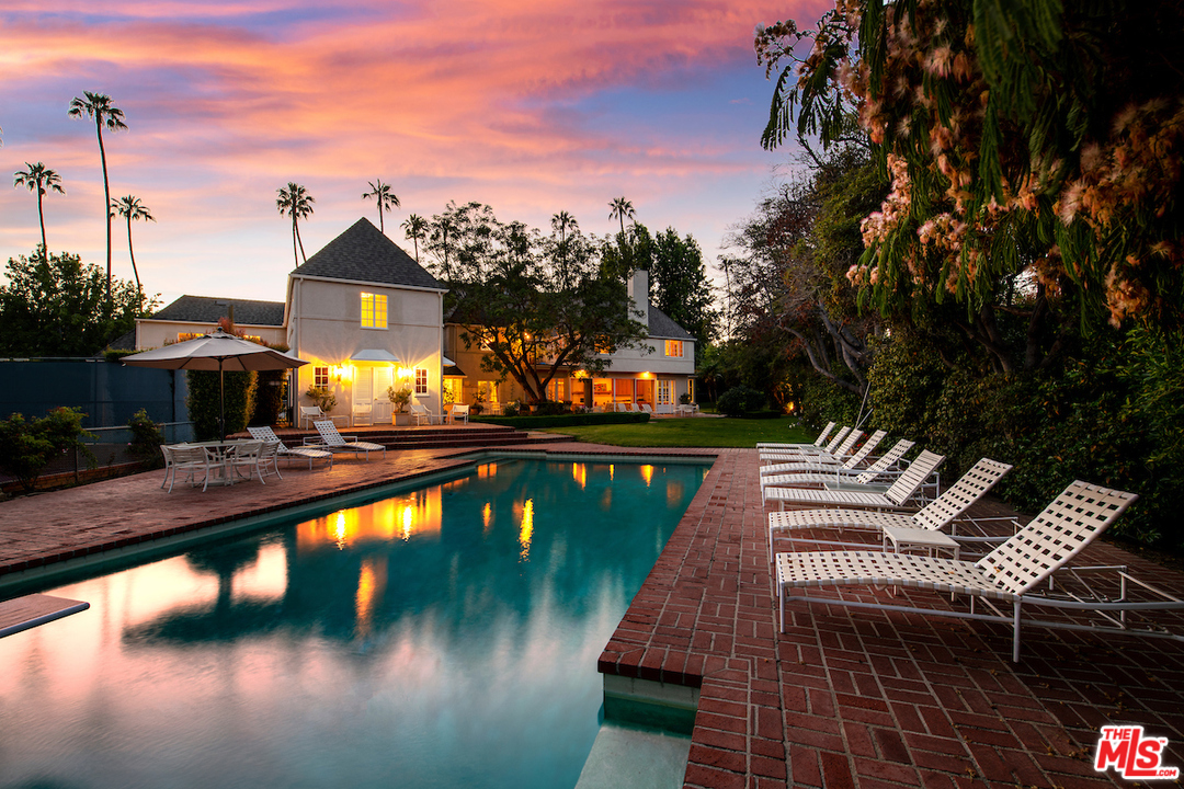 300 South Rockingham Avenue Los Angeles, CA 90049 - Photo 3 of 49 a view of swimming pool with seating space
