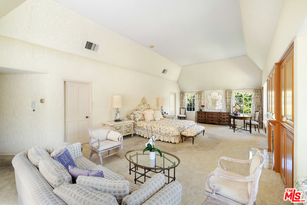 300 South Rockingham Avenue Los Angeles, CA 90049 - Photo 34 of 49 a spacious bathroom with a double vanity sink a mirror and a shower