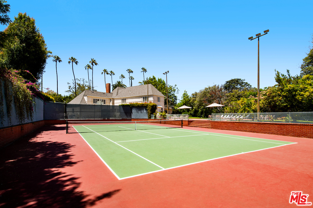 300 South Rockingham Avenue Los Angeles, CA 90049 - Photo 45 of 49 a view of a swimming pool and a chairs