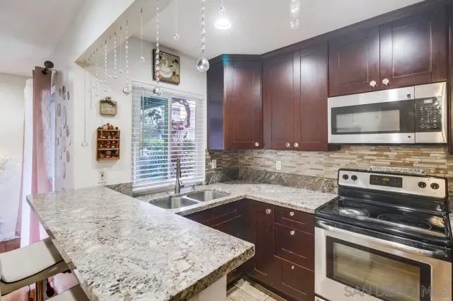a kitchen with a stove and a microwave