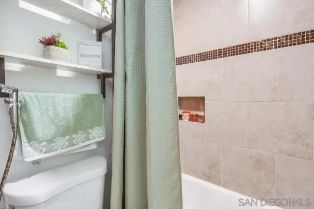 a bathroom with a bathtub and shower