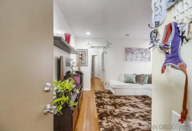a living room with furniture and flowers