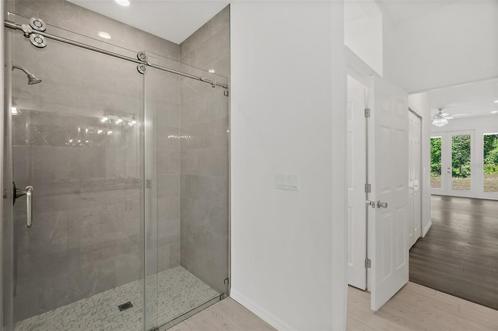 1370 Buckles Road Pierson, FL 32180 - Photo 21 of 57 a bathroom with a glass shower door