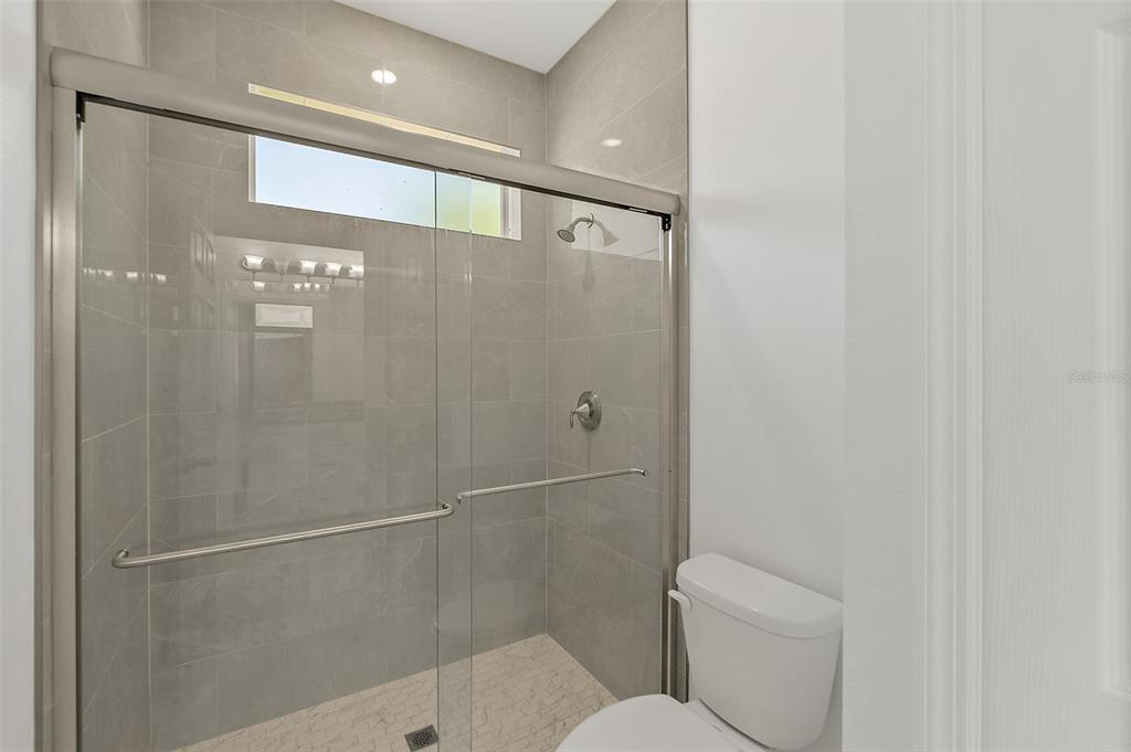 1370 Buckles Road Pierson, FL 32180 - Photo 25 of 57 a bathroom with a shower and a toilet