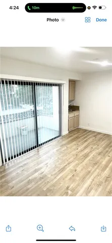 a view of a livingroom with wooden floor
