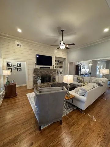 a kitchen with a table chairs refrigerator and cabinets
