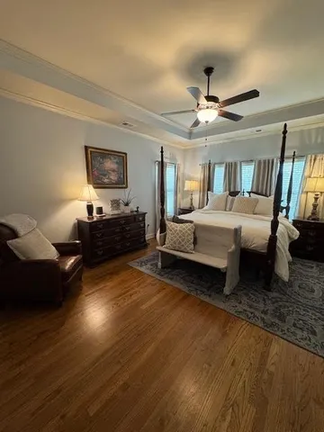 a living room with furniture a window and a chandelier
