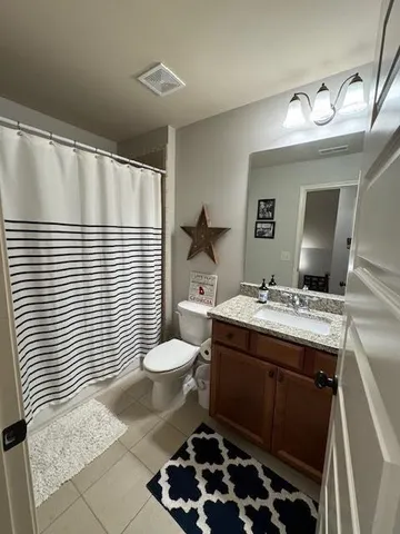 a living room with furniture fireplace and a flat screen tv