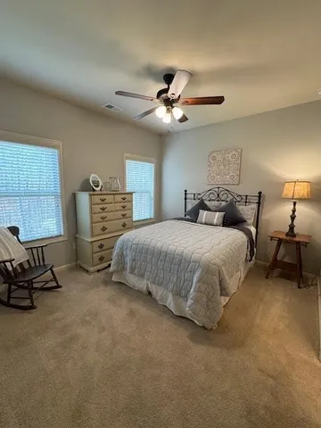 a building outdoor space with patio furniture and potted plants