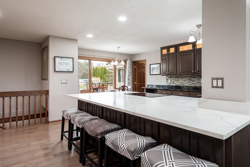 2412 Squaw Prairie Road Belvidere, IL 61008 - Photo 13 of 40 a kitchen with a table chairs sink and cabinets
