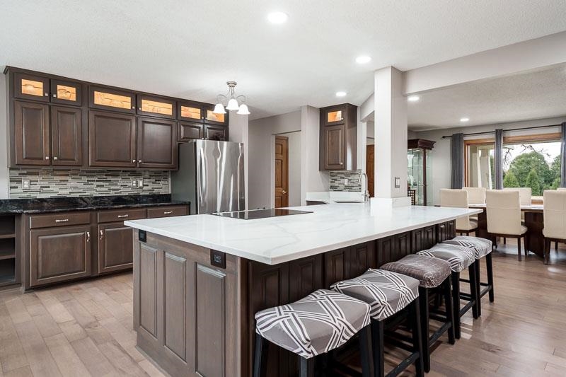 2412 Squaw Prairie Road Belvidere, IL 61008 - Photo 14 of 40 a large kitchen with a table and chairs