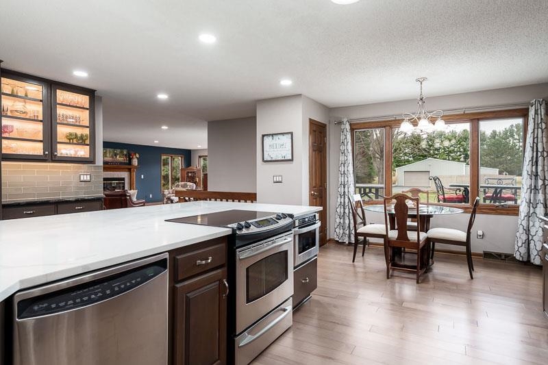 2412 Squaw Prairie Road Belvidere, IL 61008 - Photo 16 of 40 a kitchen with a stove and a microwave