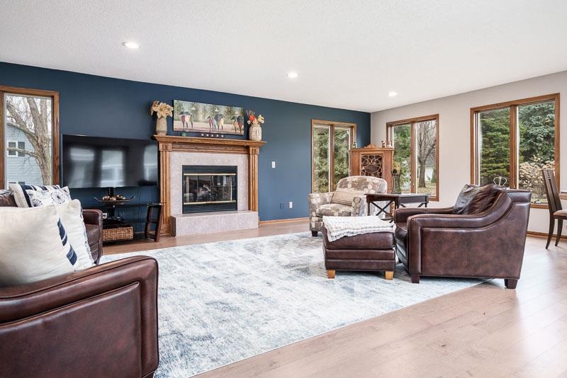 2412 Squaw Prairie Road Belvidere, IL 61008 - Photo 17 of 40 a living room with furniture and a fireplace