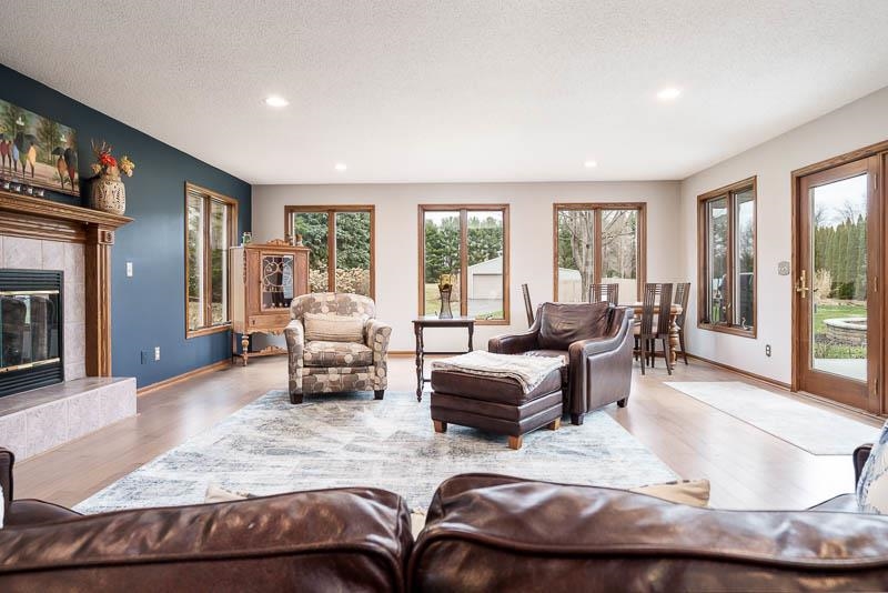 2412 Squaw Prairie Road Belvidere, IL 61008 - Photo 18 of 40 a living room with furniture window and a fireplace