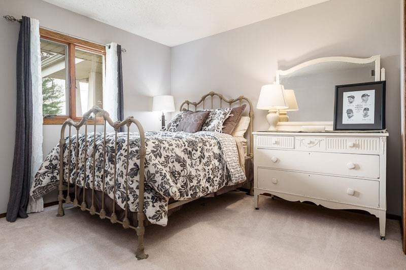 2412 Squaw Prairie Road Belvidere, IL 61008 - Photo 22 of 40 a bed room with a bed and a dresser