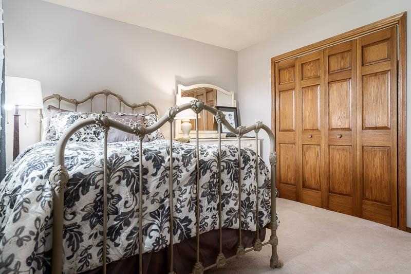 2412 Squaw Prairie Road Belvidere, IL 61008 - Photo 23 of 40 a bedroom with a bed and a table