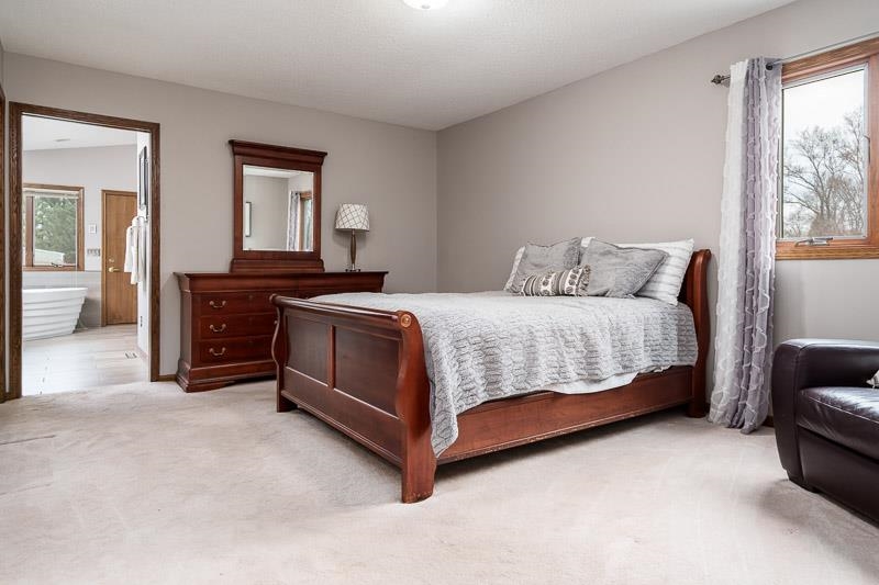 2412 Squaw Prairie Road Belvidere, IL 61008 - Photo 26 of 40 a bedroom with a bed and a couch