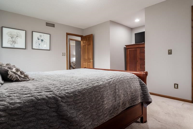 2412 Squaw Prairie Road Belvidere, IL 61008 - Photo 27 of 40 a bedroom with a bed and a window