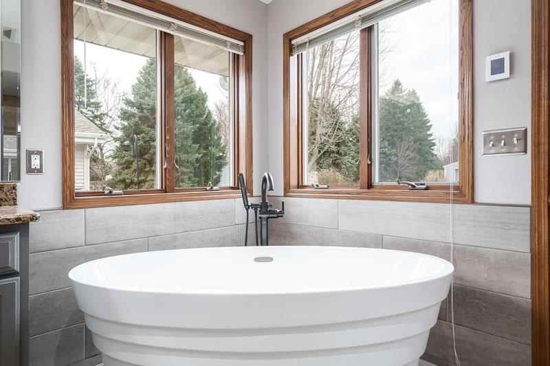 2412 Squaw Prairie Road Belvidere, IL 61008 - Photo 30 of 40 a white bath tub sitting in a bathroom