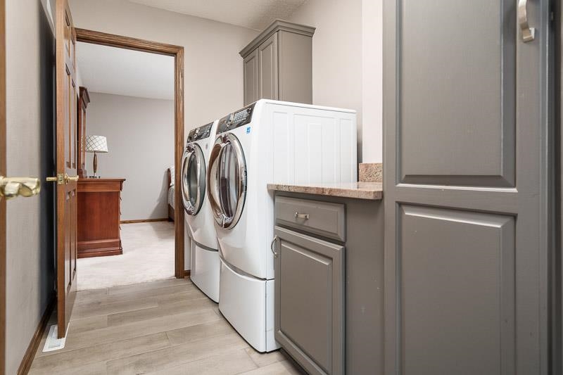2412 Squaw Prairie Road Belvidere, IL 61008 - Photo 32 of 40 a utility room with dryer and washer
