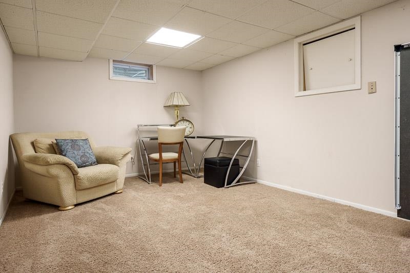 2412 Squaw Prairie Road Belvidere, IL 61008 - Photo 34 of 40 a living room with furniture a couch and a table