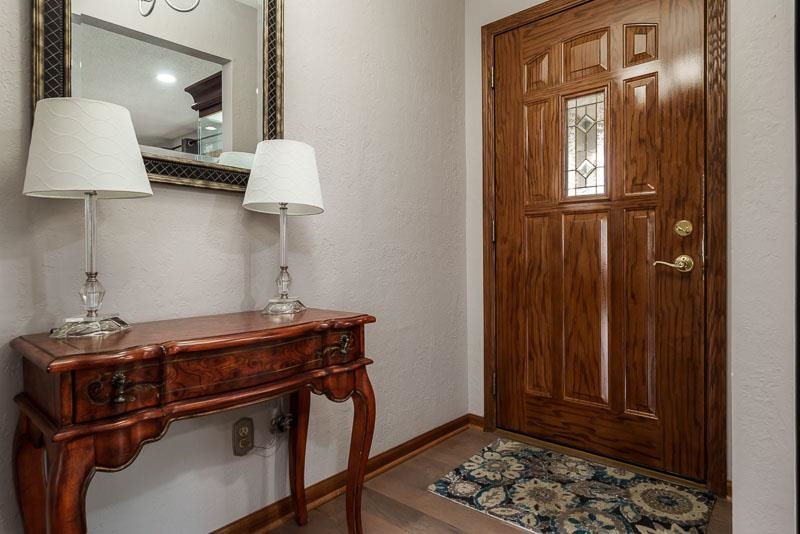 2412 Squaw Prairie Road Belvidere, IL 61008 - Photo 9 of 40 a room with chairs and a lamp with wooden floor