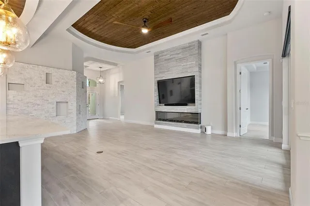 a kitchen with kitchen island granite countertop a sink center island and cabinets