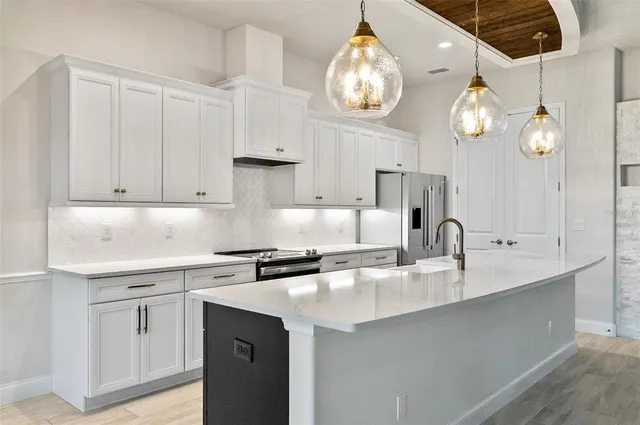 a living room with a fireplace and a flat screen tv