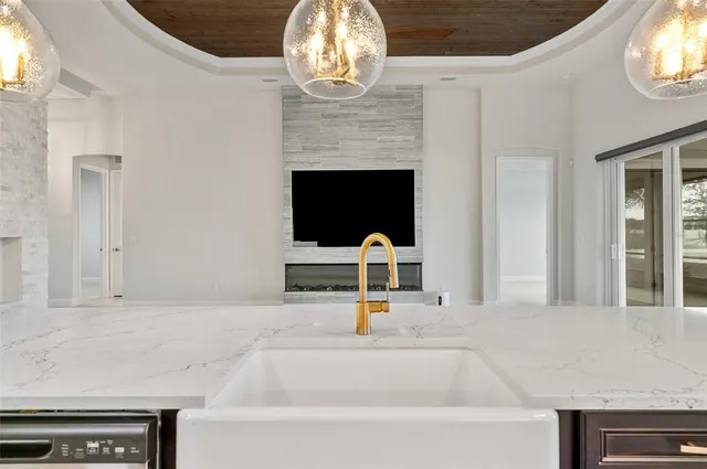 a view of an empty room with closet and mirror