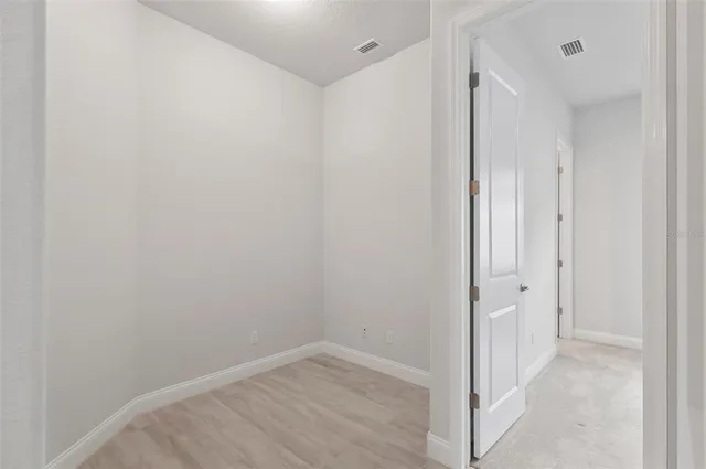 a bathroom with a sink vanity and a mirror